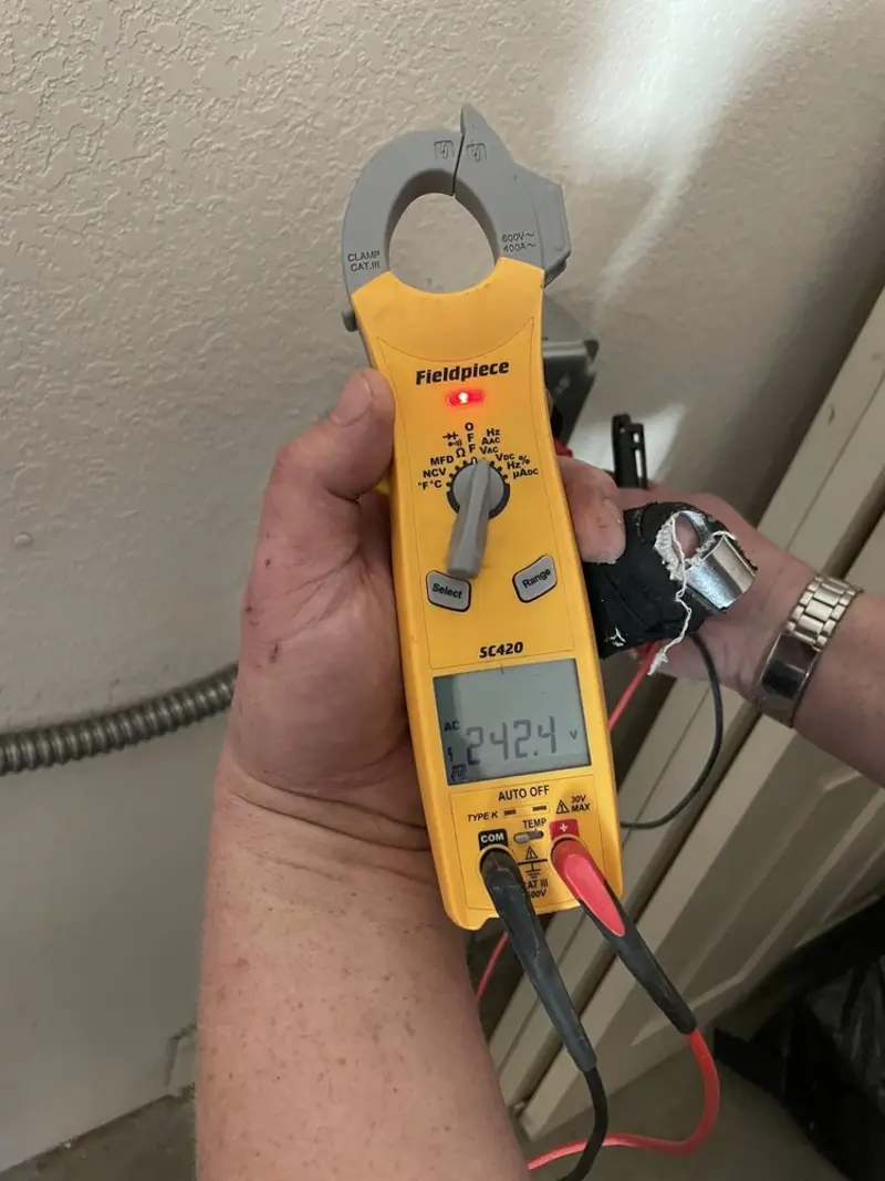 Voltage testing with clamp meter during Electrical Installation Services in Miami Springs